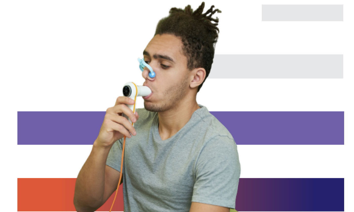 black man using spirometer